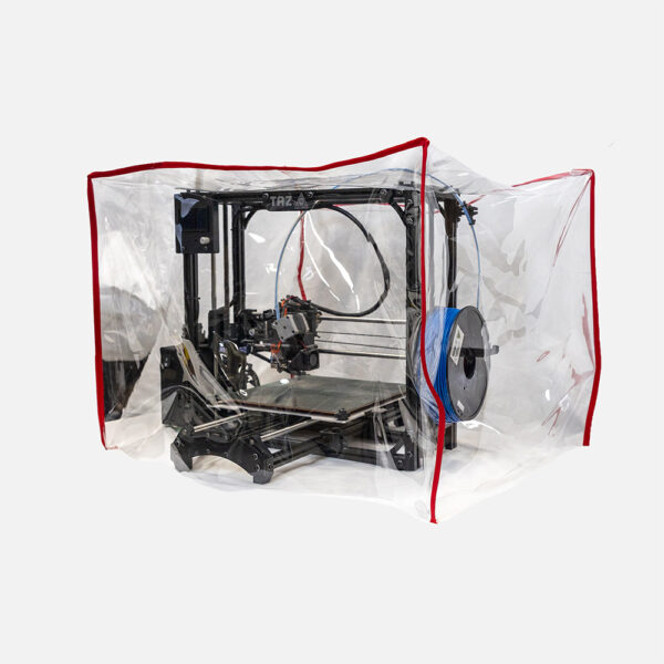 a 3D printer is covered by a clear square shaped protective cover with red fabric trim